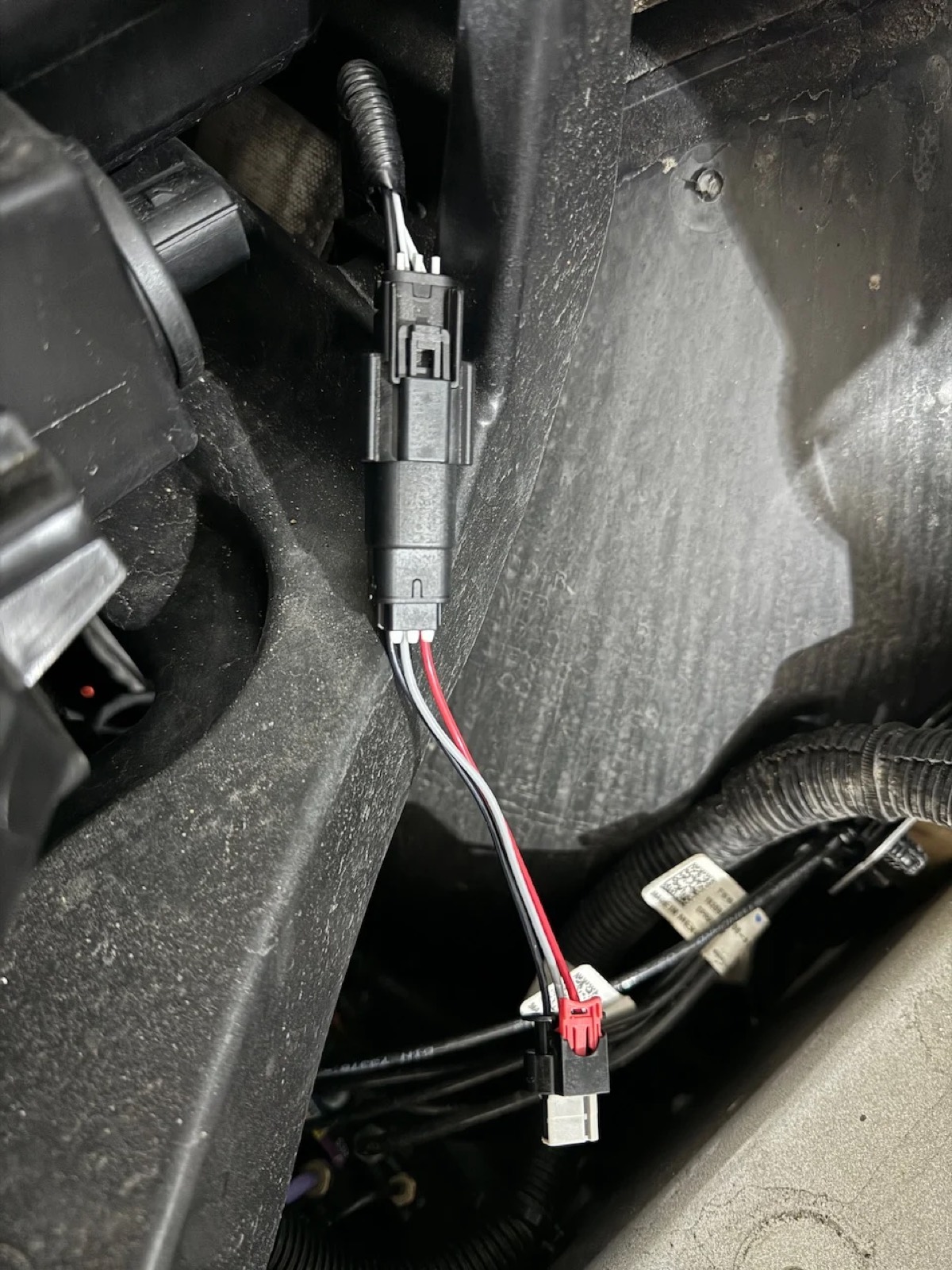 The finished adapter installed in the car, plugged in behind the fascia