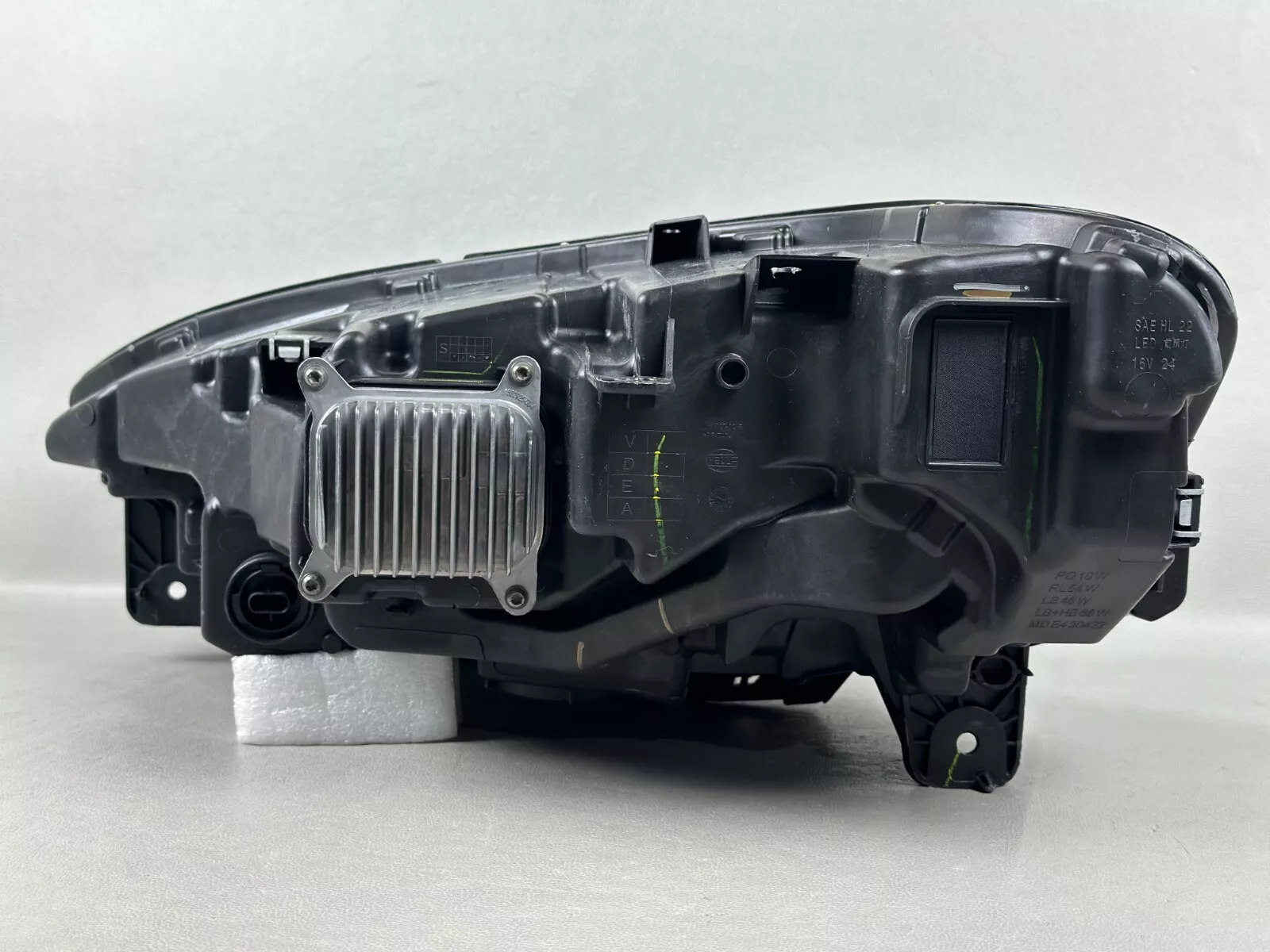 Rear of a Model X Matrix headlight housing with the 16V rating on the label